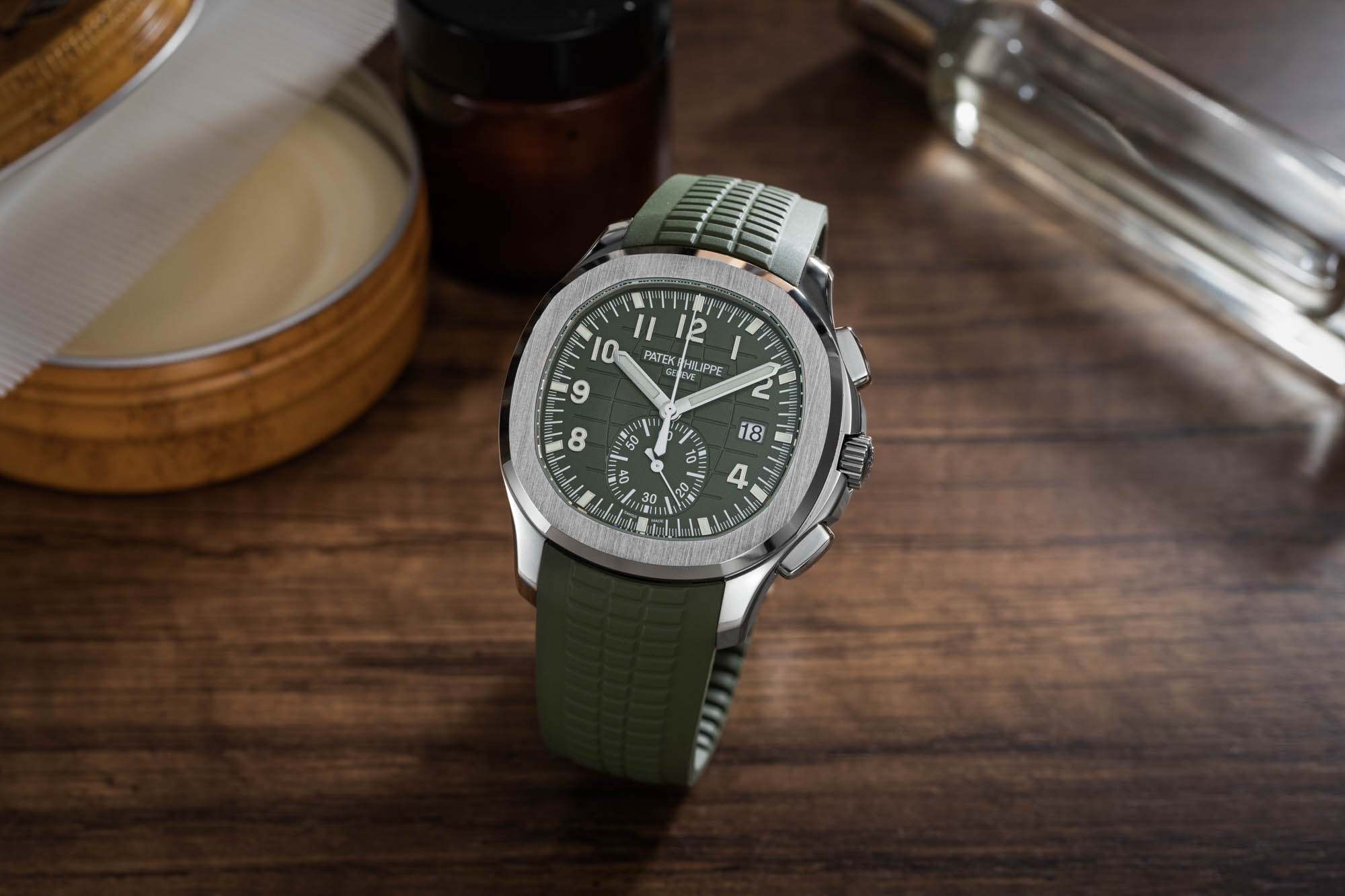 Patek Philippe Aquanaut Flyback Chronograph Ref. 5968G 010 Features A Khaki Green Dial And Matching Composite Strap, Contrasting Nicely With Its White Gold Case, Bezel, And Crown.