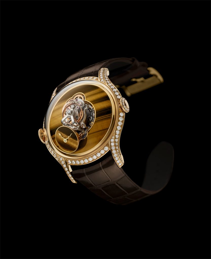 Round watch with gold and diamond case and tiger eye dial