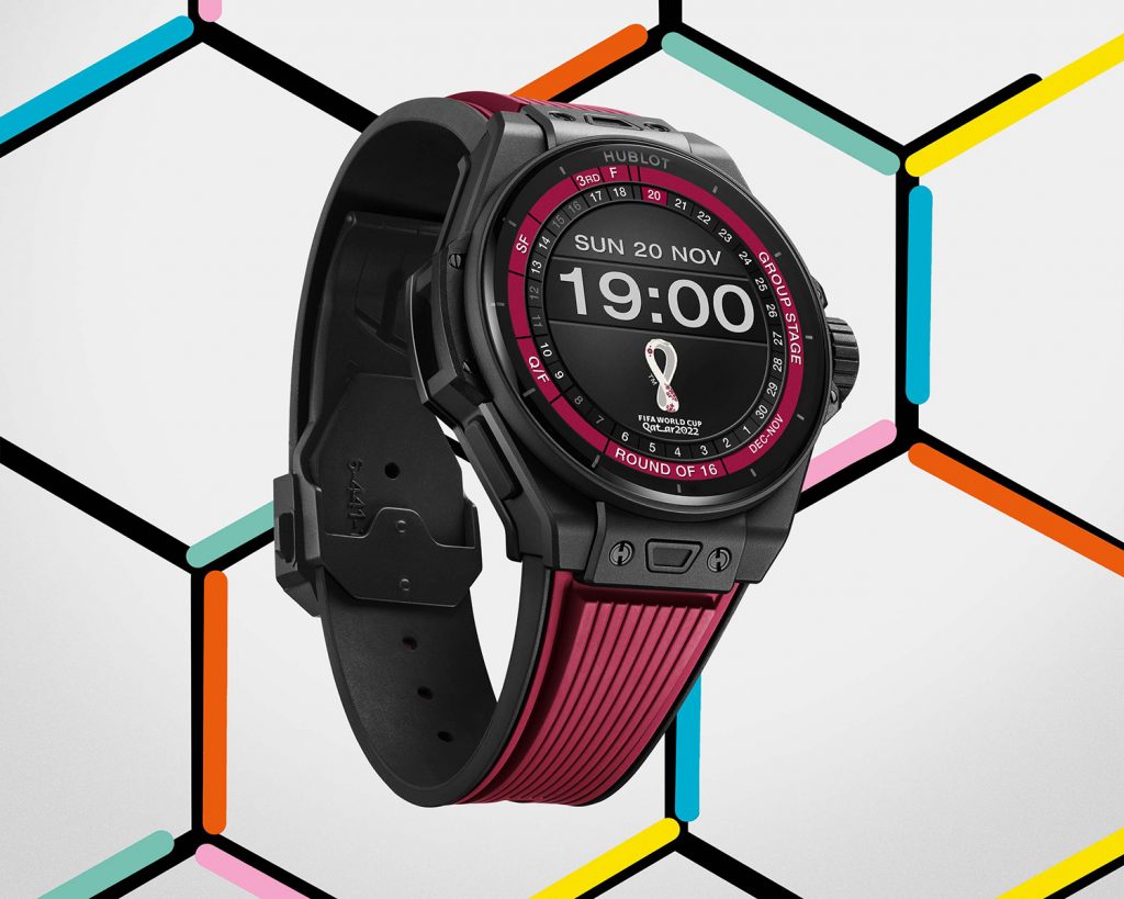 Connected watch with black ceramic case and burgundy rubber strap