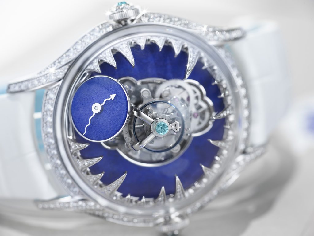 Close up of watch with blue lapis lazuli dial and diamond setting