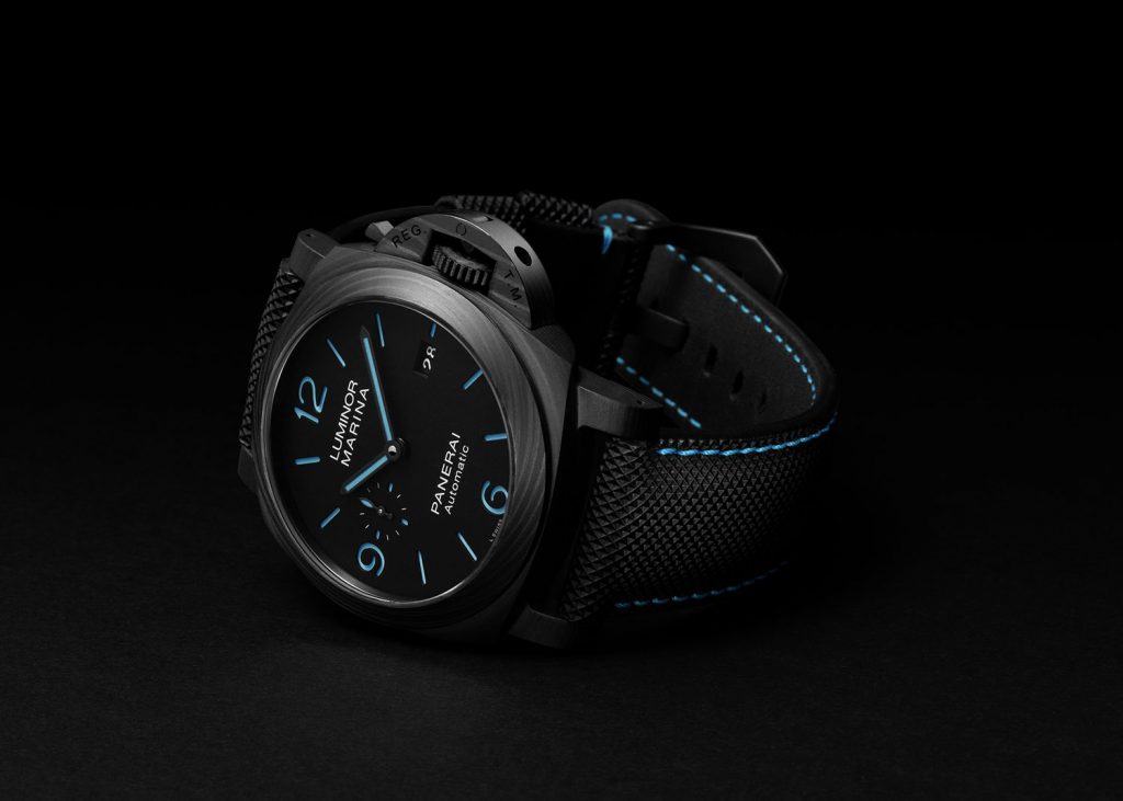 Black case watch with dark blue dial and blue luminous hands and markers